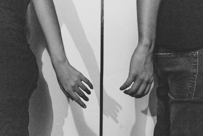 Low section of woman standing on floor at home