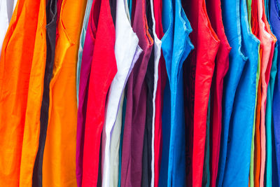 Full frame shot of colorful clothes hanging in store