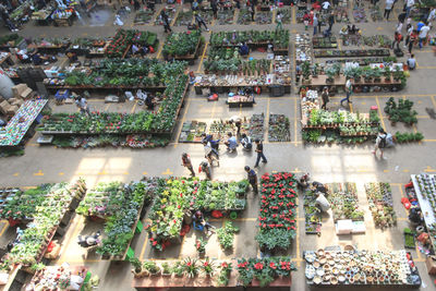 High angle view of people walking in market