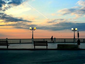 Silhouette pier on sea against sky during sunset