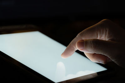 Close-up of hand holding mobile phone