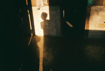 Shadow of person on tiled floor