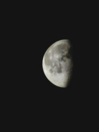 Low angle view of moon against sky at night