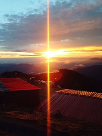 Scenic view of mountains against sky at sunset