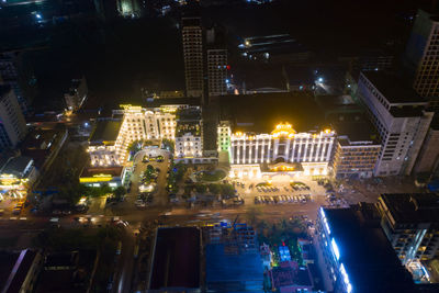 High angle view of illuminated buildings in city at night