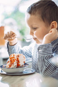 Close-up of girl eating food