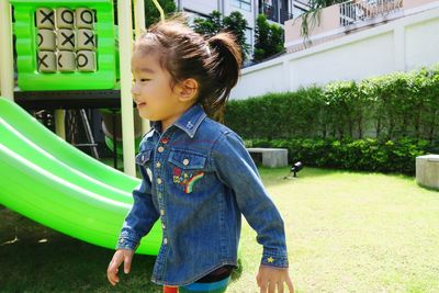 Girl looking away playing outdoors