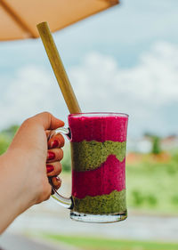 Midsection of person holding drink