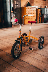 Toy bicycle on wooden table