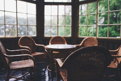 Close-up of chairs on table