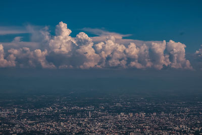 Aerial view of city against sky