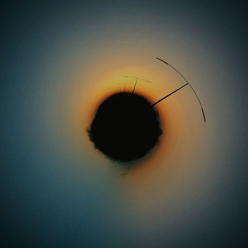 circle, sky, sunset, close-up, silhouette, copy space, nature, tranquility, outdoors, beauty in nature, leisure activity, unrecognizable person, lifestyles, reflection, dusk, tranquil scene, scenics, hole