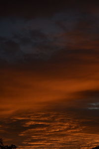 Scenic view of dramatic sky at sunset