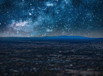 Scenic view of sea against sky at night