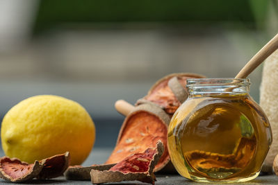 Close-up of fruits in glass jar on table