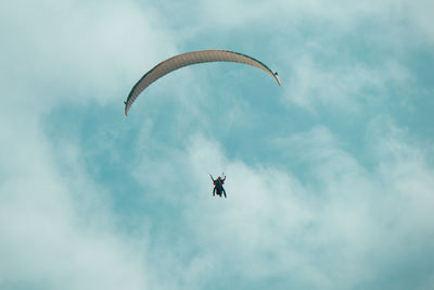 Low angle view of airplane flying in sky