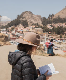 Rear view of woman wearing hat