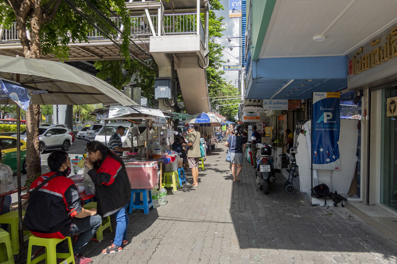 PEOPLE ON STREET IN MARKET