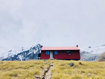 Hut on the summit with mountain surrounding 