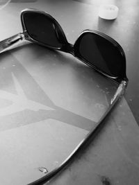 Close-up of sunglasses on table