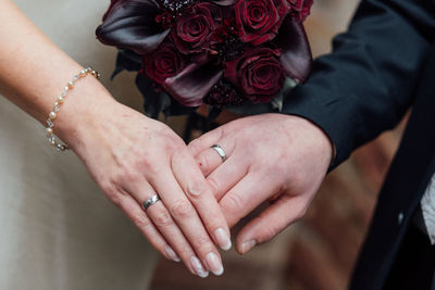 Close-up of couple holding hands