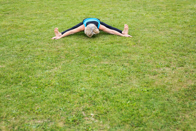 Full length of woman lying on grass
