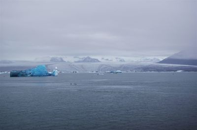 Scenic view of sea against sky during winter