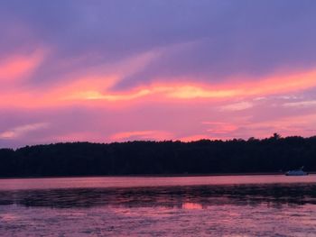 Scenic view of lake at sunset