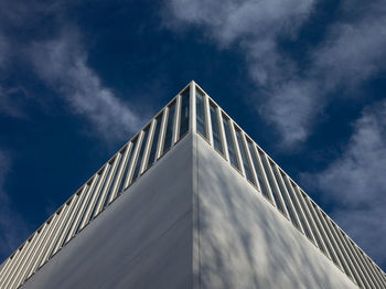 Low angle view of building against cloudy sky