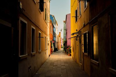 Alley amidst buildings in city