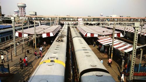 High angle view of train at railroad station against sky