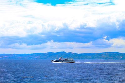 Scenic view of sea against cloudy sky