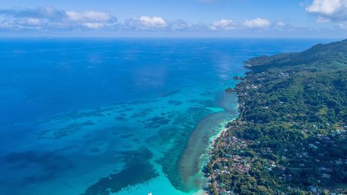 Scenic view of sea against blue sky