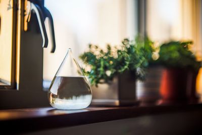 Water in jar on window sill