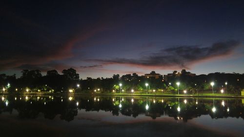 Scenic view of lake against sky at night