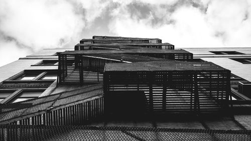 Low angle view of building against cloudy sky