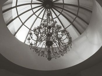 Low angle view of chandelier hanging on ceiling in building