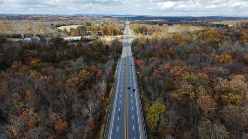 High angle view of road amidst trees