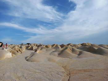 Panoramic view of rocks on land against sky