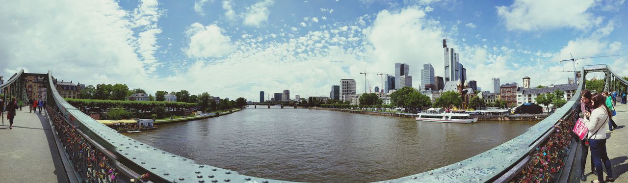 architecture, built structure, building exterior, city, sky, water, cloud - sky, skyscraper, cityscape, river, panoramic, tall - high, tree, modern, tower, cloudy, cloud, travel destinations, office building, city life