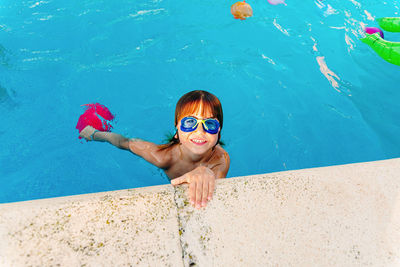 Portrait of girl swimming in pool