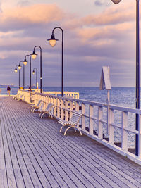 Scenic view of pier on sea against sky