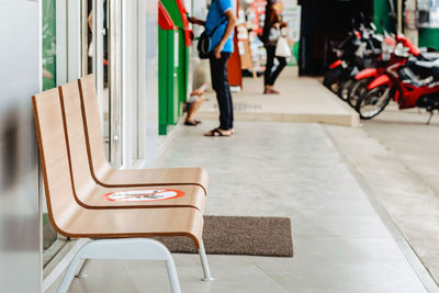 Low section of woman walking on seat