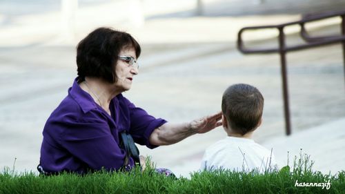 Close-up of woman standing on bench