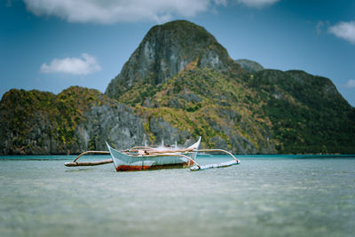 Scenic view of sea against mountains