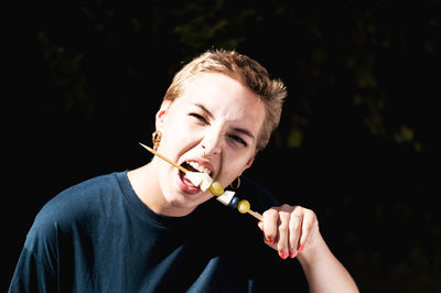 Portrait of man eating food