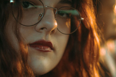 Close-up of young woman looking away