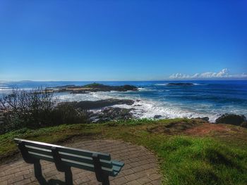 Scenic view of sea against clear blue sky