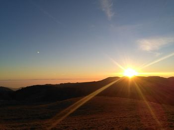 Scenic view of silhouette landscape against sky during sunset