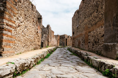 View of old ruin building against cloudy sky